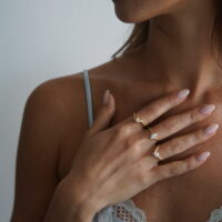 gold solitaire tension engagement ring